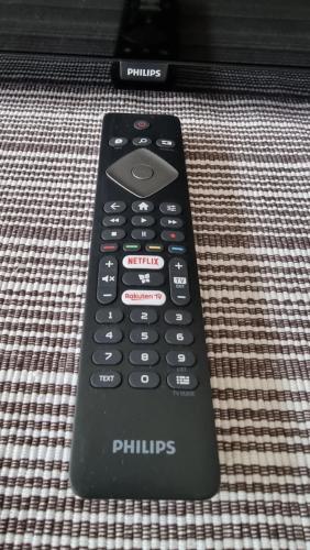 a remote control sitting on top of a bed at FeWo Resse in Gelsenkirchen