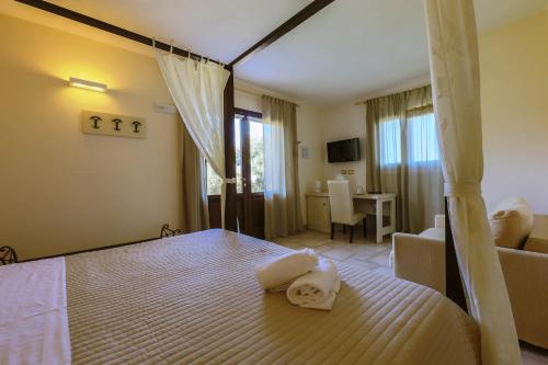 Postel nebo postele na pokoji v ubytování Corte Di Ferro Hotel & Wellness Resort