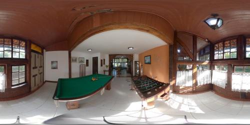 a large room with a pool table in it at Quari Quara BY MN Hotéis in Rio das Ostras