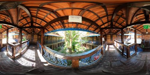 an inside view of a building with a tree in it at Quari Quara BY MN Hotéis in Rio das Ostras
