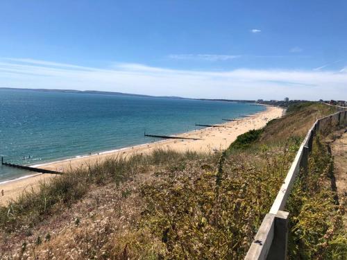 a view of the beach from a bluff at New one bed 1st floor flat close to the beach in Southbourne