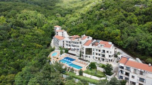 an aerial view of a large house with a swimming pool at Adria Sea & Mountains in Herceg-Novi