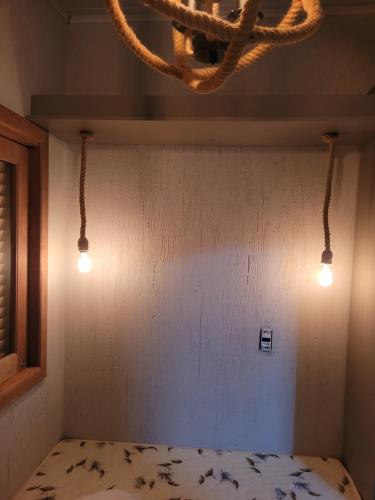 Ein Bett oder Betten in einem Zimmer der Unterkunft Novo lar Garopaba Terraço