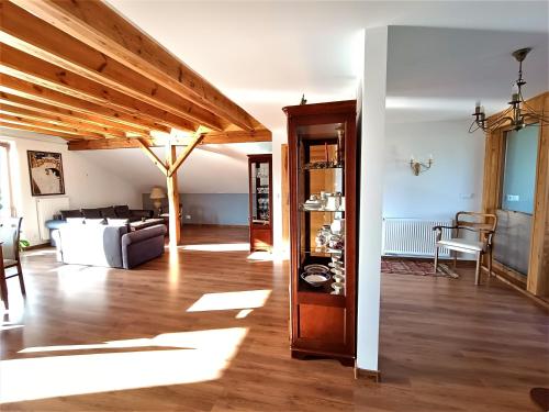 a living room with a couch and a table at Barytowy apartament in Tarnowskie Góry