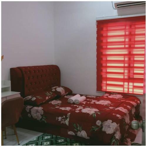 a bedroom with a bed and a red window at Homestay Ibu(Muslim sahaja) in Ipoh