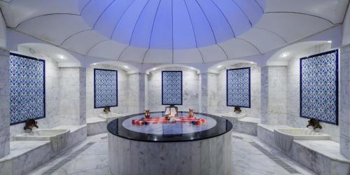 a large room with a round table in the middle at Liberty Hotels Lara in Lara