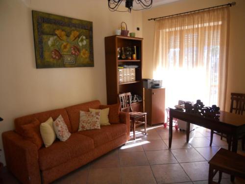 a living room with a couch and a table at Albergo Maria Cristina in Esperia