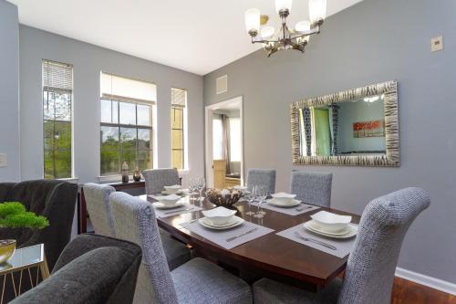 a dining room with a table and chairs at COZY Condo - Perfect Location Close to Disney in Kissimmee