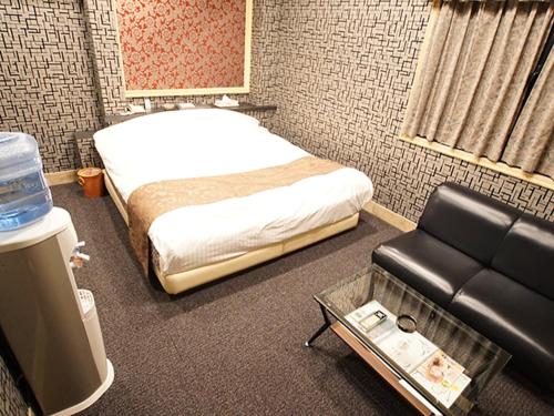 Postel nebo postele na pokoji v ubytování フラミンゴ　大人専用
