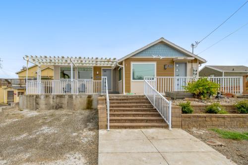 a house with a staircase in front of it at Ebb Tide in Lincoln City