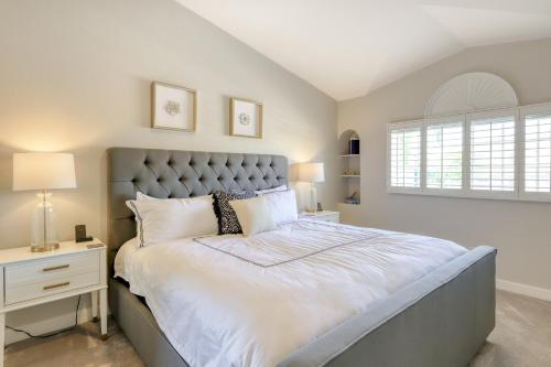 a bedroom with a large bed and a window at Luxe on the Links in Phoenix