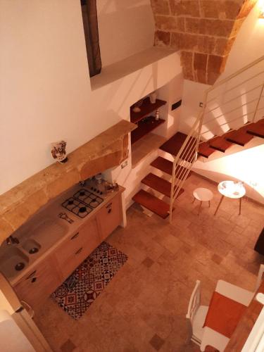 an overhead view of a kitchen and stairs in a house at Casa vacanze salento Vicosoluna in Morciano di Leuca