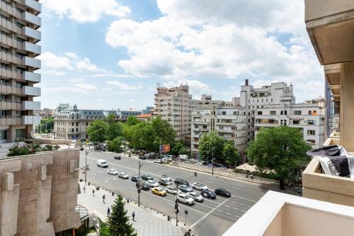 a view of a city street with cars on the road at Qult - Dune in Bucharest