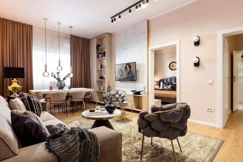 a living room with a couch and a table at Qult - Dune in Bucharest
