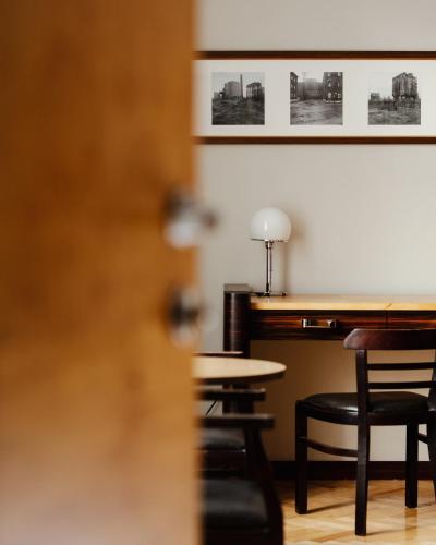 a view of a table and chairs in a restaurant at Hotel Monopol in Katowice