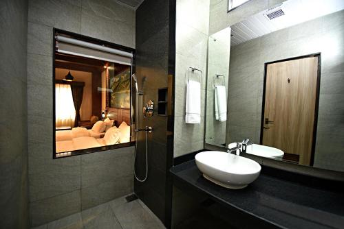 a bathroom with a sink and a mirror at Everest Boutique Hotel in Kathmandu