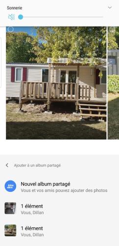 a page of a website with a house with a deck at Mobil home Amira 3 Trigano in Saint-Jean-de-Monts