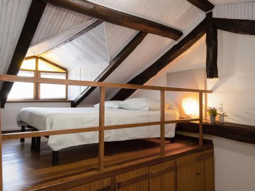 a bedroom with a bed in a attic at Casa Cecilia in Santo Stefano Belbo