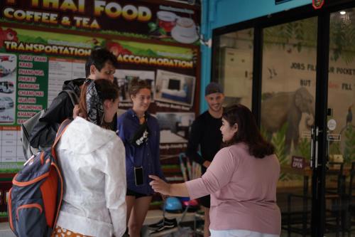 a group of people standing in front of a store at Chillax Khaosok Hostel - SHA Certified in Khao Sok