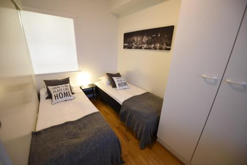 Säng eller sängar i ett rum på Rental Apartment Tuurepori Suomen Vuokramajoitus Oy