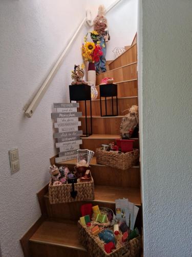 a set of stairs with baskets of toys at FAMILIE BRANDT in Bad Ischl