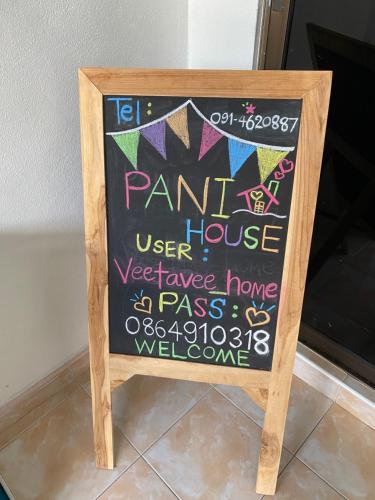 a chalkboard sign with a name of a park house at Pani House Hatyai 1 in Hat Yai