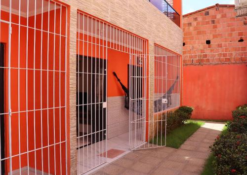 a group of metal cages on the side of a building at Casa Lua Nova na Praia de Peroba, Maragogi in Maragogi