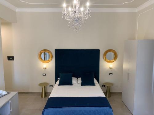 a hotel room with a bed, nightstand, and nightstand at B&B Amaris in Palermo