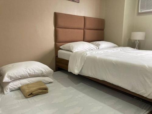 Ліжко або ліжка в номері 11F Migas Haven @ Sunvida Tower across SM City