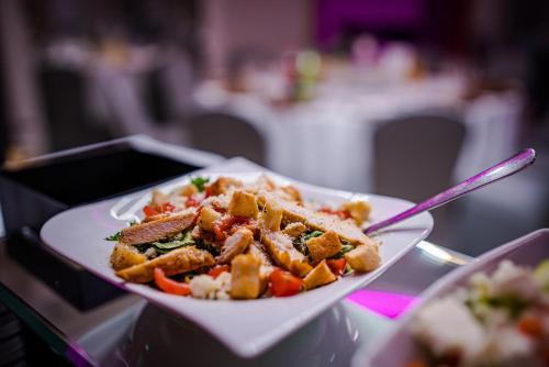 a plate of food on a table with a plate of food at GLAMOUR - Restaurant & SPA in Przeźmierowo
