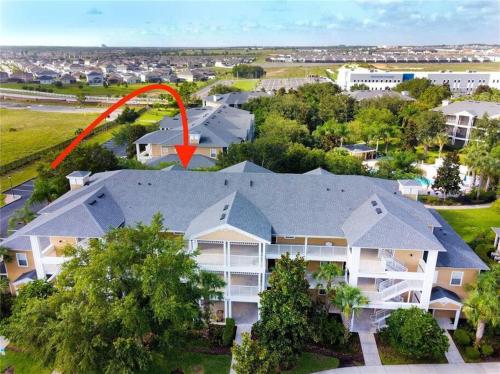 an aerial view of a house with a red arrow on it at Hidden Oasis near Orlando, Disney, etc. in Kissimmee
