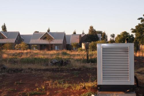 a white object in a field in front of a house at Eldorado Lodge CC in Kuruman