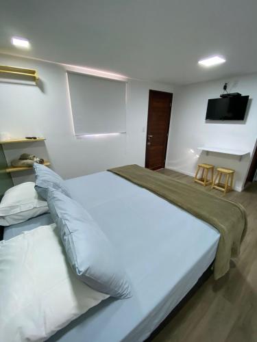 Ένα ή περισσότερα κρεβάτια σε δωμάτιο στο CASA PITANGA