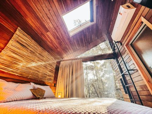 Cama ou camas em um quarto em Pousada Alpes da Araucárias