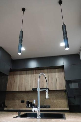 a kitchen with a sink and a faucet at Lovely, newly remodeled apartment in Yerevan! in Yerevan