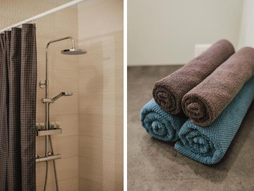 two pictures of a bathroom with towels and a shower at Rozenstein design apartment in Brocēni