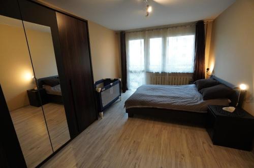Posteľ alebo postele v izbe v ubytovaní Apartment 6 Gwiazdek