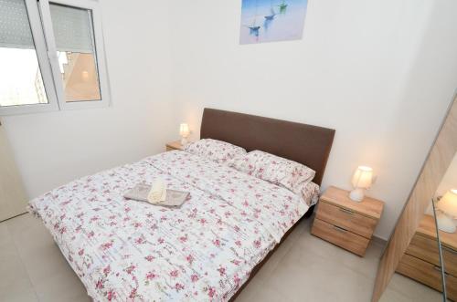 Ένα ή περισσότερα κρεβάτια σε δωμάτιο στο Four Seasons Apartments
