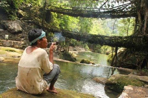 a man taking a picture of a river at PHIBHA VILLA in Shillong
