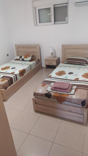 A bed or beds in a room at Mama Marina apartement near to the airport