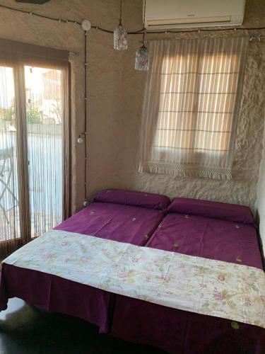 Postel nebo postele na pokoji v ubytování LA BUHARDILLA