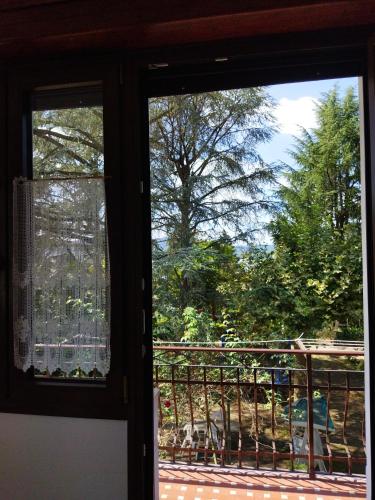 a view out of a window of a balcony at Appartamento doppi bagni sei posti letto in Viverone