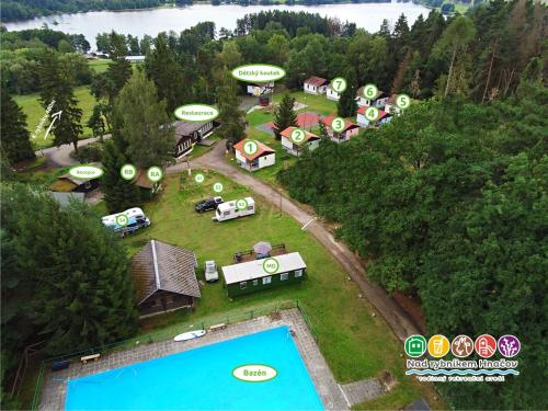 an aerial view of a house with a pool at Chata Nad rybníkem Hnačov 