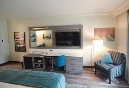 a hotel room with a desk and a bed and a chair at Blue Lake Casino and Hotel in Blue Lake
