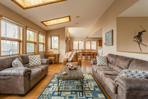 a living room with a couch and a table at Mountaintop Lookout with Hot Tub under the Stars in Hunter