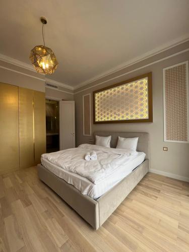 Ένα ή περισσότερα κρεβάτια σε δωμάτιο στο Hotel Manica Esentai City