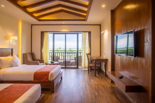 Voodi või voodid majutusasutuse Soaltee Westend Resort Chitwan toas