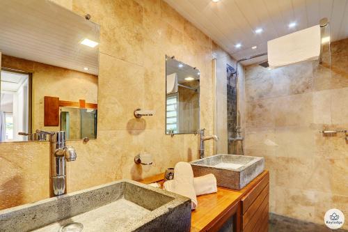 a bathroom with a large sink and a shower at Villa Honorine - Piscine privée - Saint-Gilles in Saint-Gilles-les Hauts