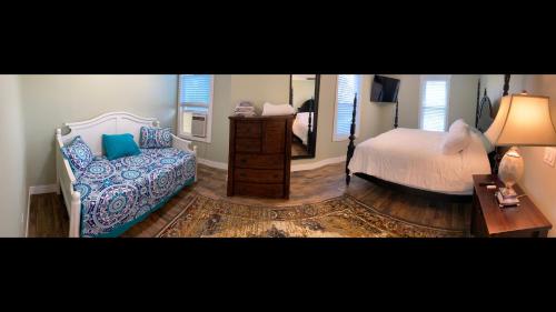 a bedroom with a bed and a mirror at 1st Class Rentals The Thurman Munson House in Cooperstown