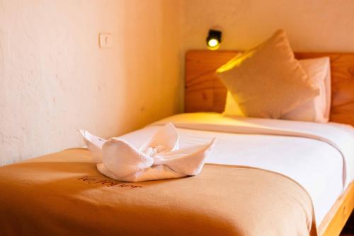 a bedroom with a bed with a white butterfly on it at Le Foyer Arequipa in Arequipa